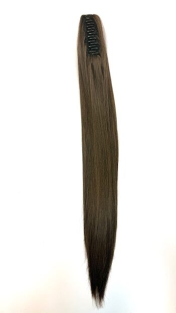 A long brown hair extension is standing up.