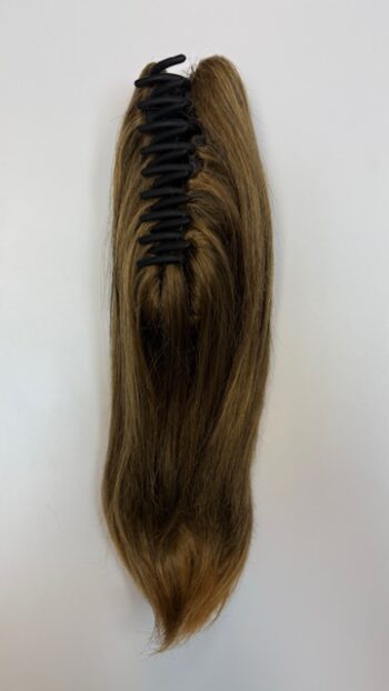 A long brown hair extension with black knots.