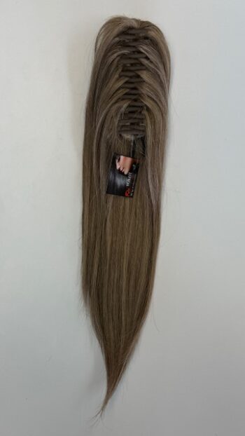 A long brown wig hanging on the wall.