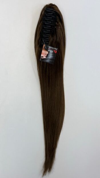 A long brown hair extension hanging on the wall.