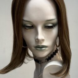 A mannequin with long hair and green eyes.