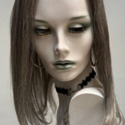 A mannequin with long hair and green eyes.