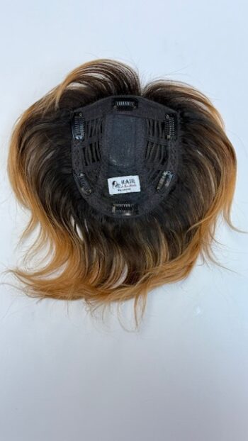 A close up of the back of a wig