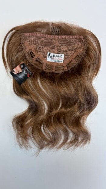 A wig is shown with hair attached to it.