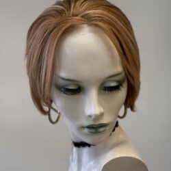 A mannequin with short hair and earrings.