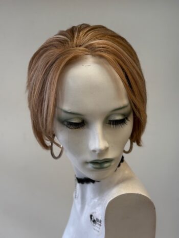 A mannequin with short hair and earrings.