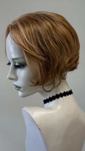 A mannequin with short hair and black lace collar.