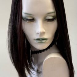 A mannequin with long hair and green eyes.