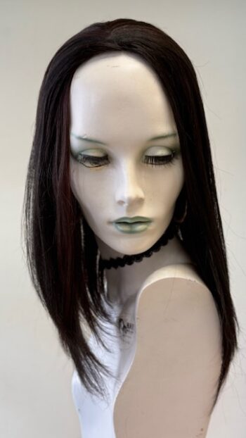 A mannequin with long hair and green eyes.