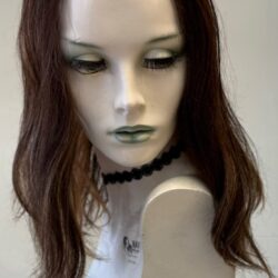 A mannequin with long brown hair and green eyes.