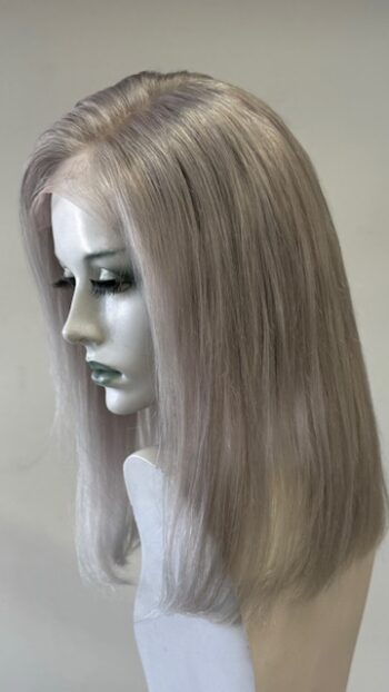 A mannequin with long white hair is wearing a wig.