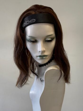 A mannequin with long hair and a headband.