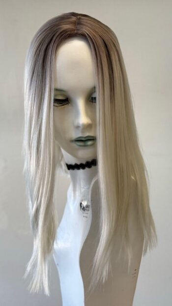 A mannequin with long white hair and a black necklace.