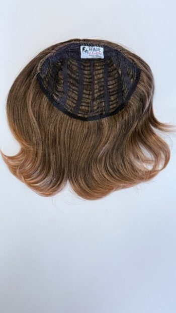 A close up of the back of a wig