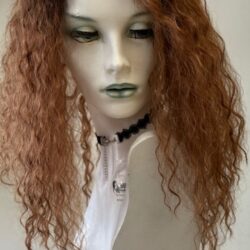 A mannequin with long curly hair and a white shirt.