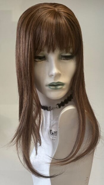 A mannequin head with long brown hair and bangs.