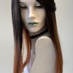 A mannequin with long hair and a necklace.