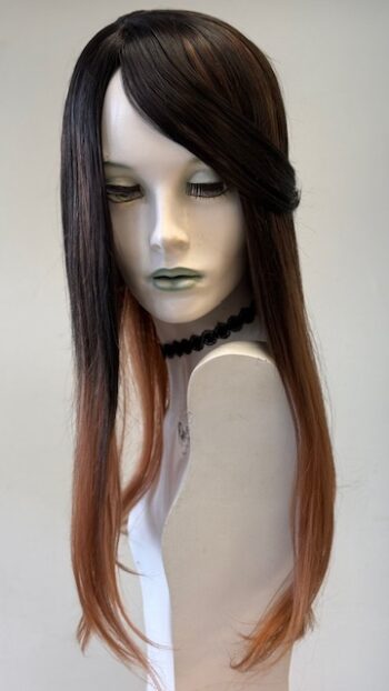 A mannequin with long hair and a necklace.