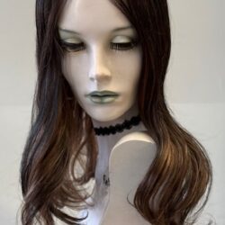 A mannequin with long hair and green eyes.