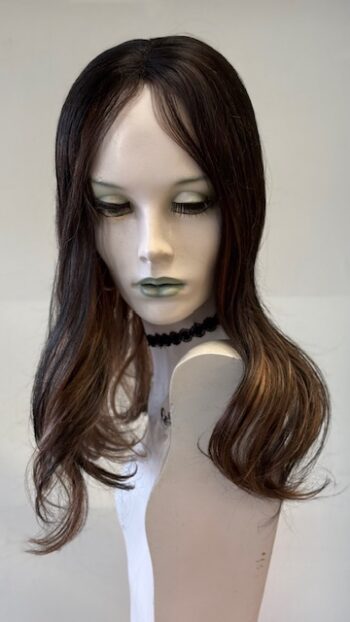 A mannequin with long hair and green eyes.