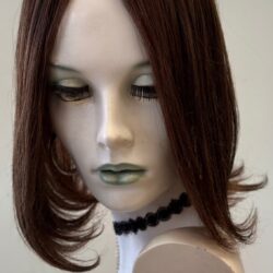 A mannequin head with a wig on it