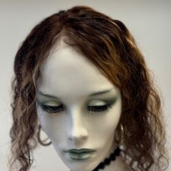 A mannequin with long hair and green eyes.